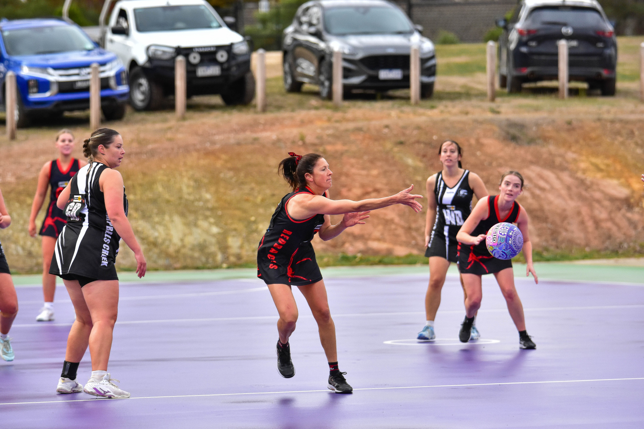 Laura Hurse sends the ball forward for Carisbrook.