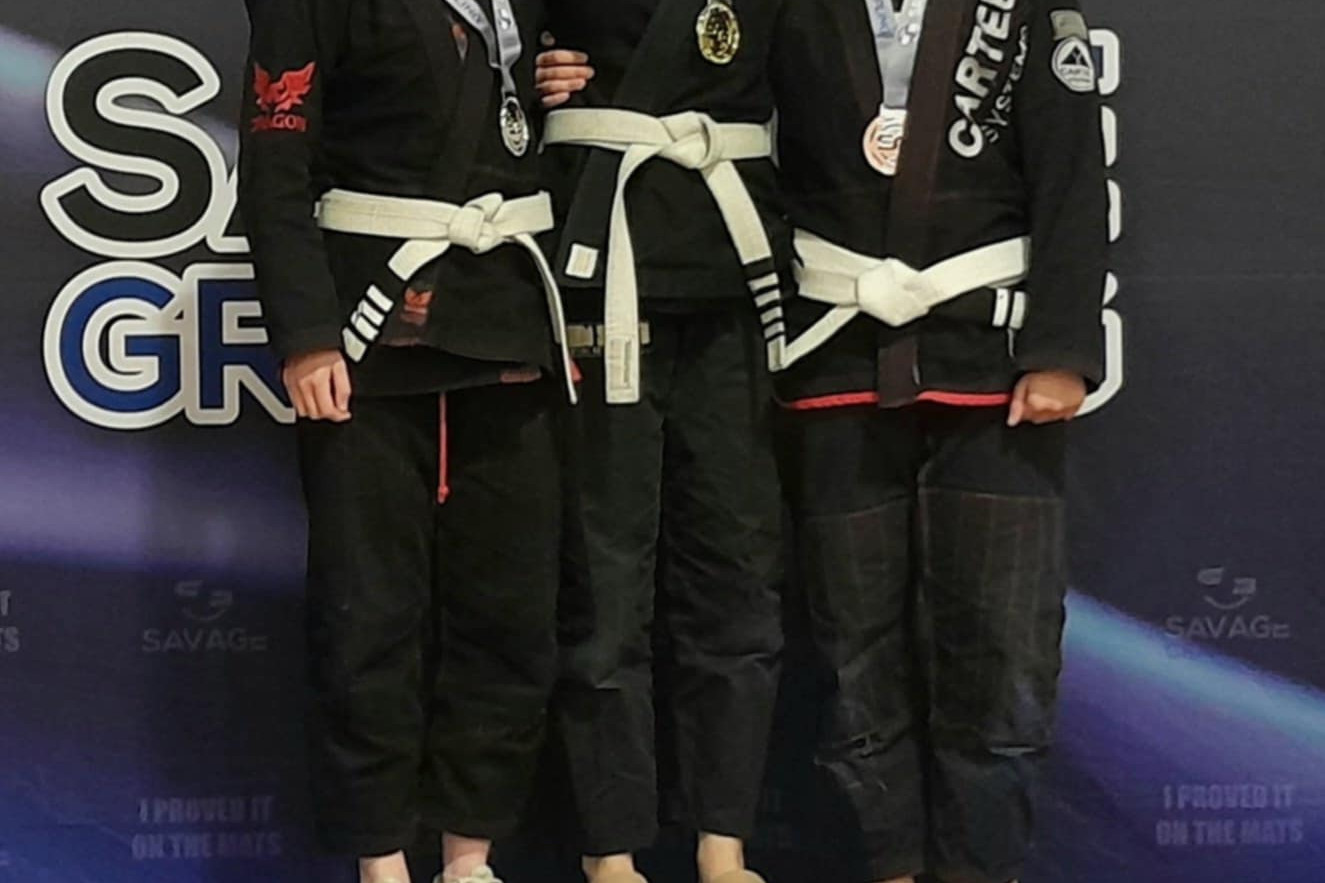 Bibby Montague celebrates her silvers on the podium.
