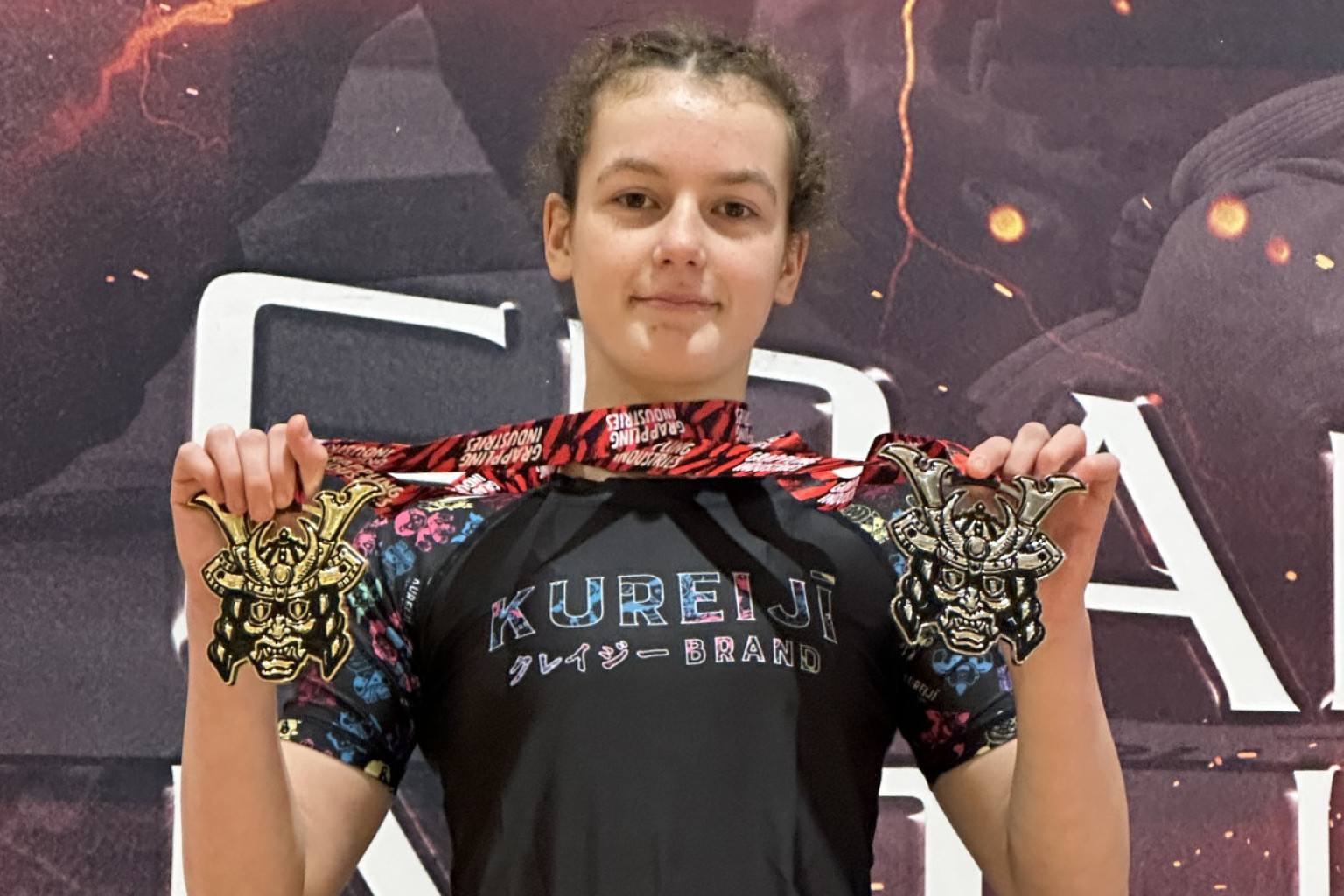Bibby Montague with her recently won gold and silver medal. Photo Supplied.
