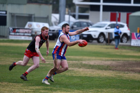 Zack Lubeek gets past Anden Lever to kick Avoca’s first goal of the game.