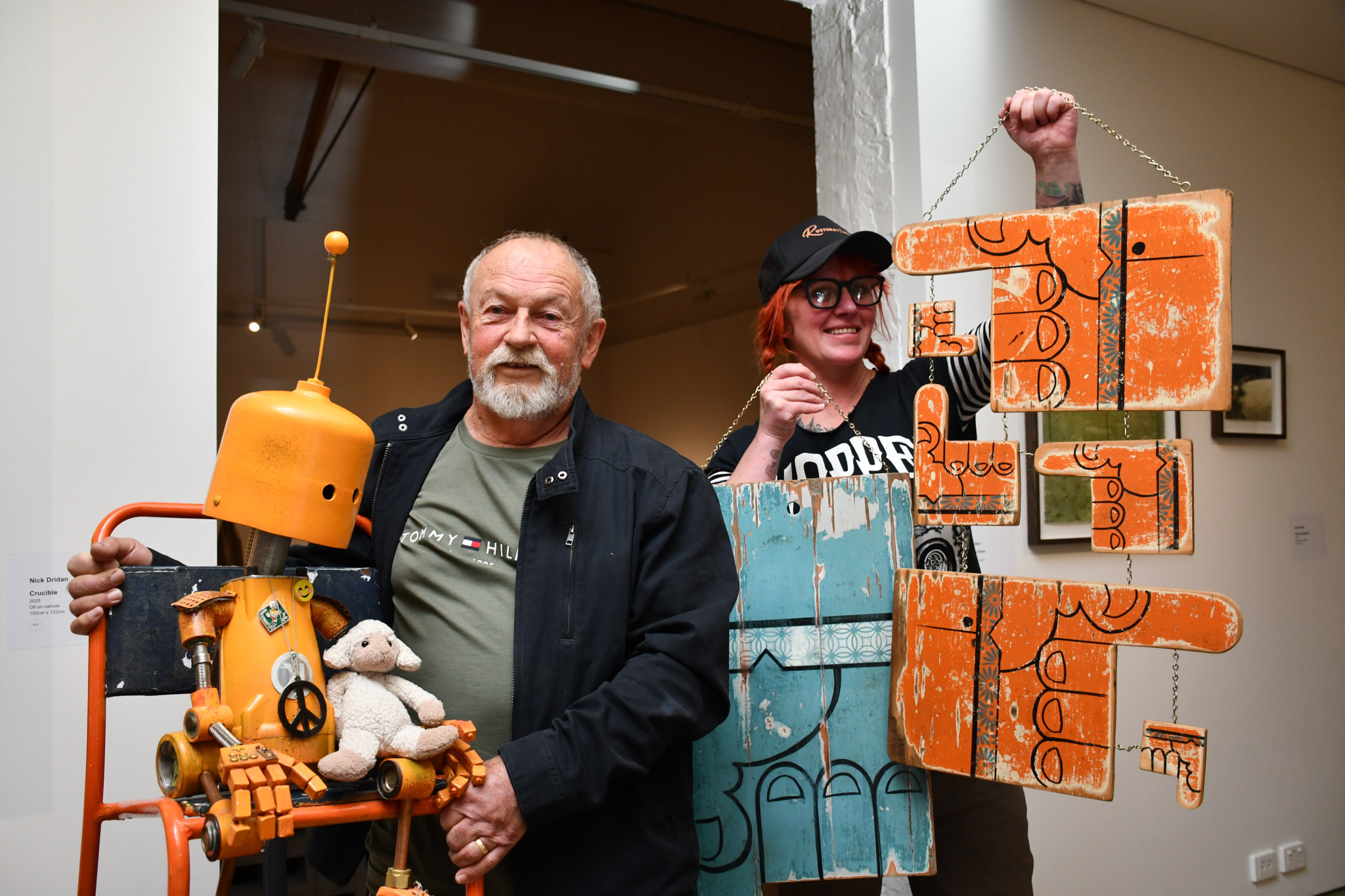Robert Liston and Jacki Irwin with impressive upcycled art they have made.