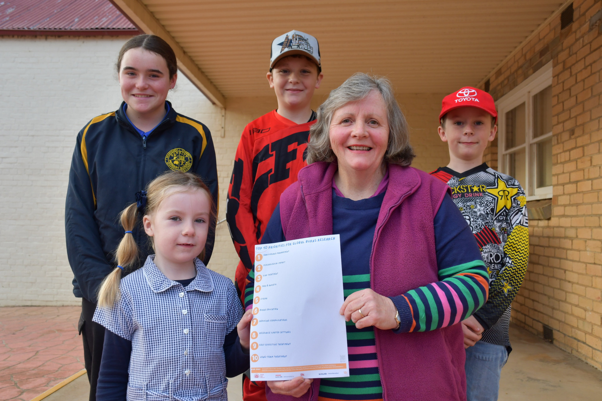 Sue Smith, second on the right, hopes new global burns research will prevent the next generation of locals like Alexis, Sigrid, Anders and Jonas from being burnt like she was.