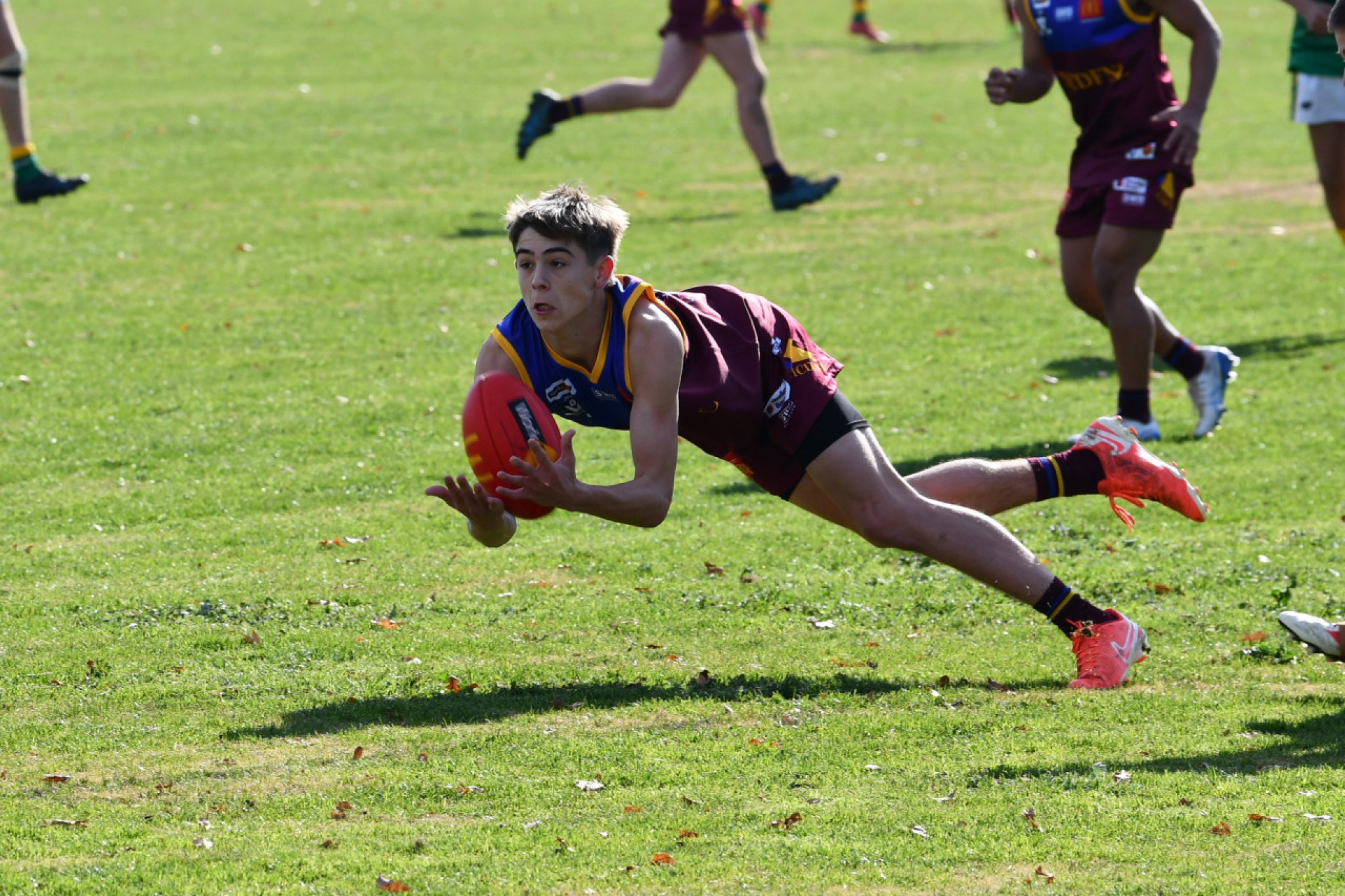 Maryborough Giants junior Issac Chamberlain attempts a diving mark as he represents the MCDFNL in the under 17.5 against the HDFNL.