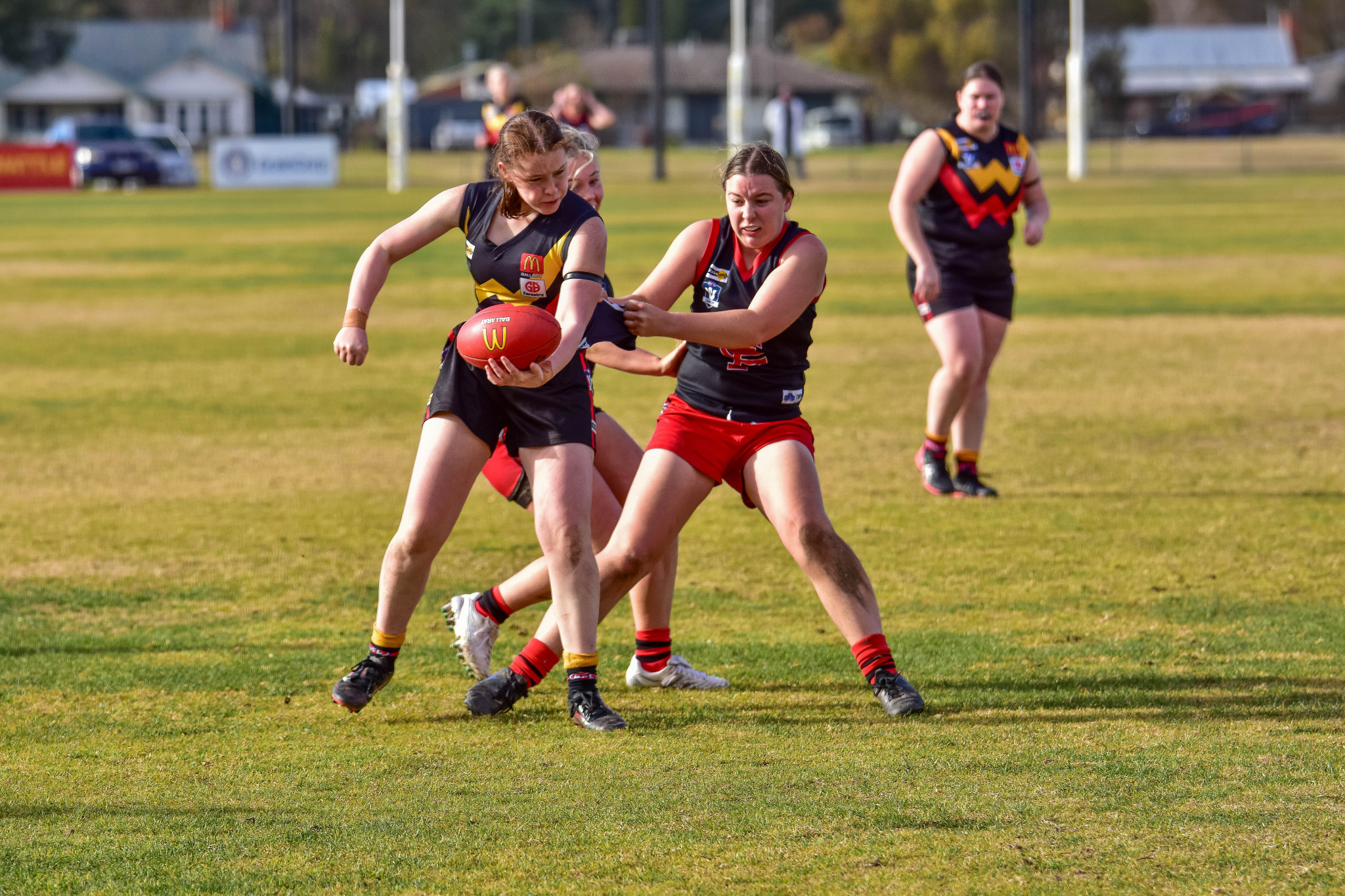 Olivia Butler, and the rest of the Carisbrook Lady Redbacks, attempted to wrangle in Bacchus Marsh at Carisbrook Recreation Reserve on Sunday.