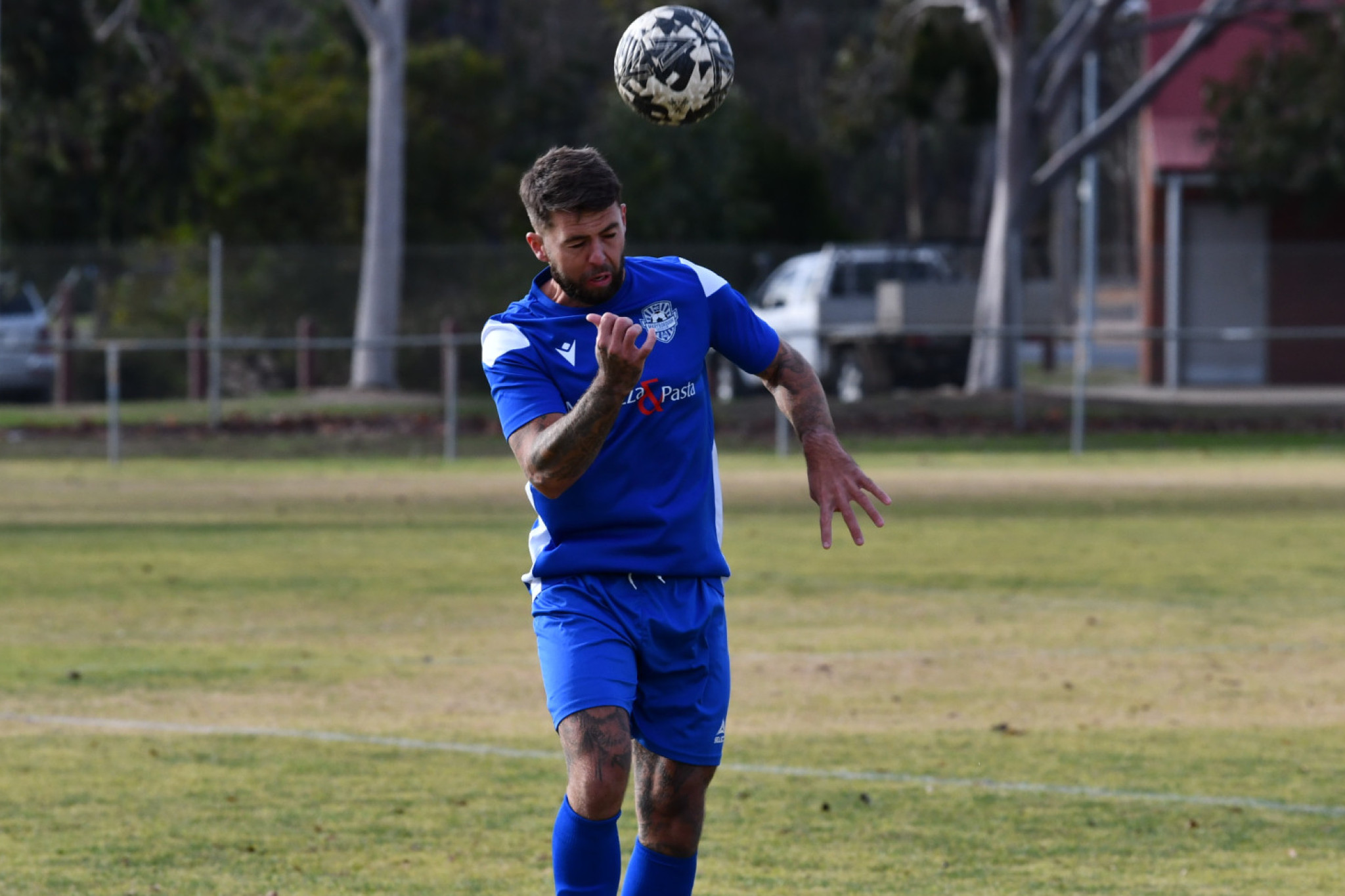 Brett Davey heads the ball.
