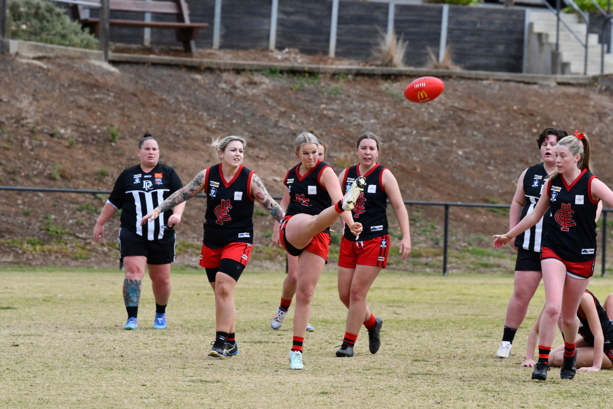 Laylah Smith boots the ball out of defence for the Carisbrook Lady Redbacks, as they fought hard against the reigning premiers Darley Devils last Sunday.