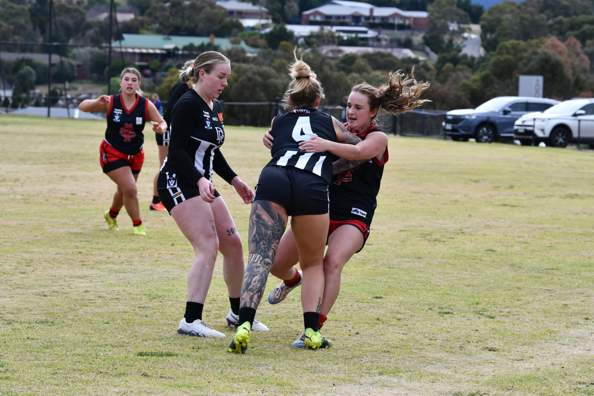 Maddison Smith lays a strong tackle in a great individual performance for the Lady Redbacks.