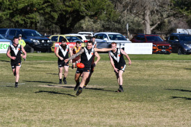 Mitchell Stevens boots the ball out of danger for Campbells Creek.