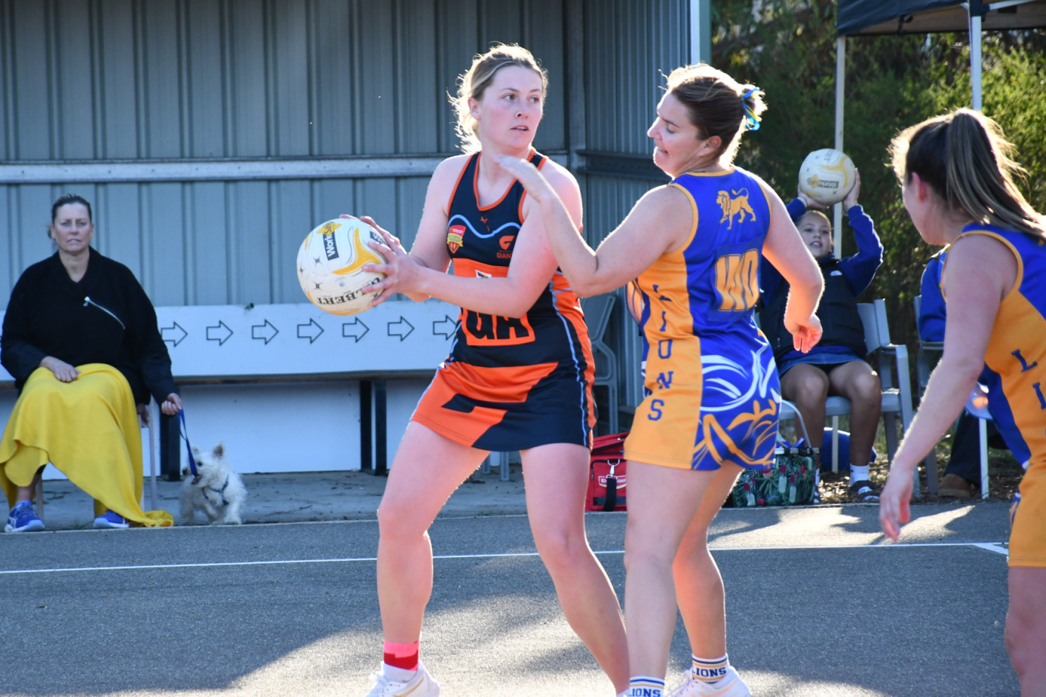 Maryborough’s Laura McStravick tries to ignore the on-ball pressure of Tamara Farr.