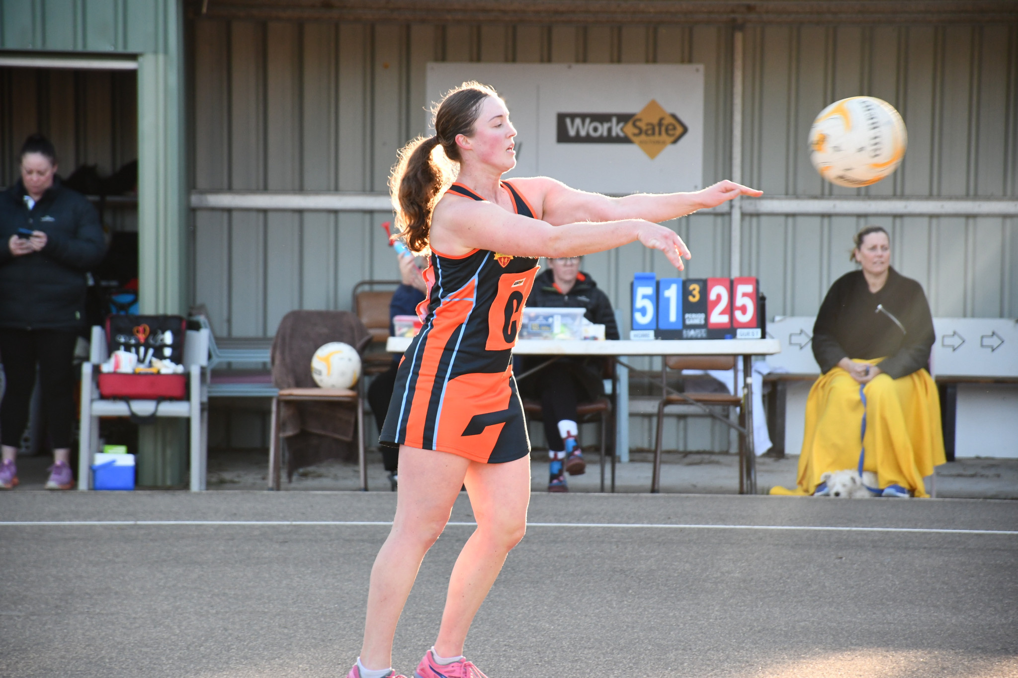 Ella Hocking fires a pass as the sun sets on a Giants victory.