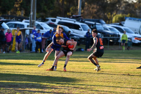 Maryborough’s Cody Wright and Harcourt’s Luke Anderson battle for the ball.
