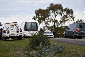 Locals continued on as best they could despite the ongoing investigation and crime scene on their street. 080725 11