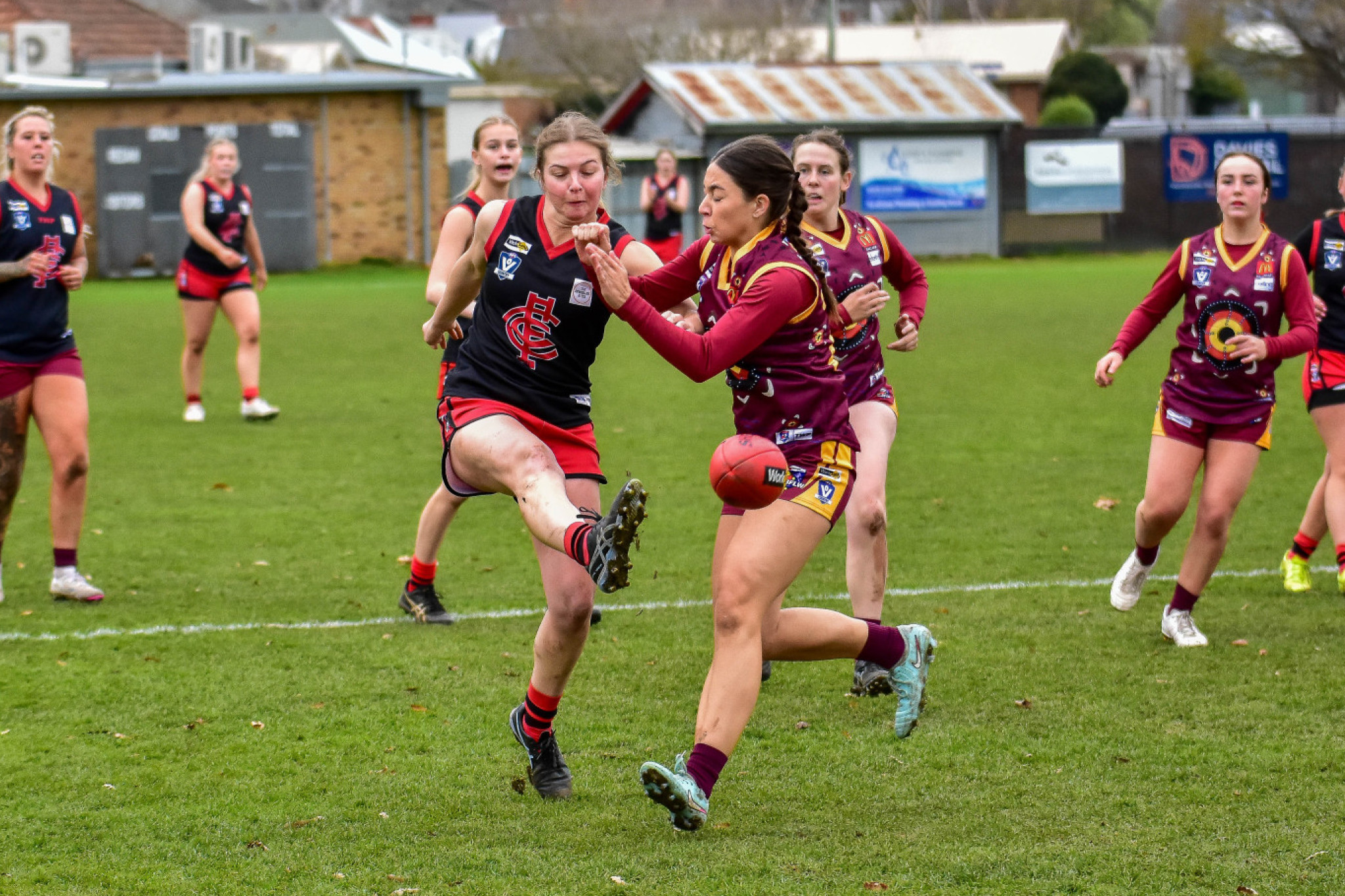 Sarah Dridan kicks under pressure for the Lady Redbacks.