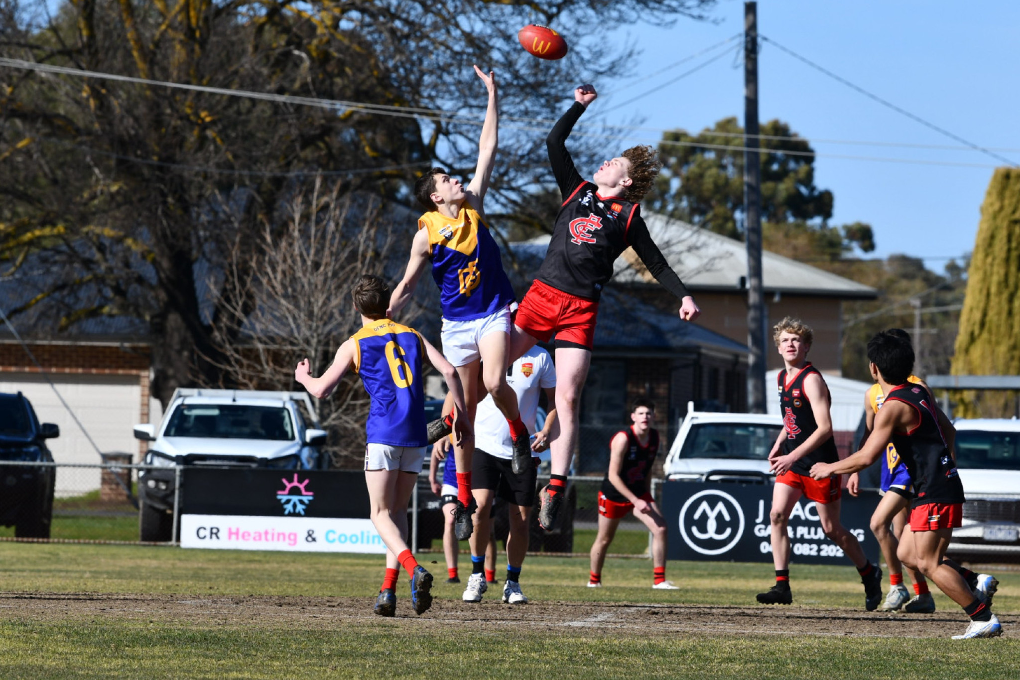 Bayden Lever and Nash Fraser battle it out in the ruck in the under 17.5s.