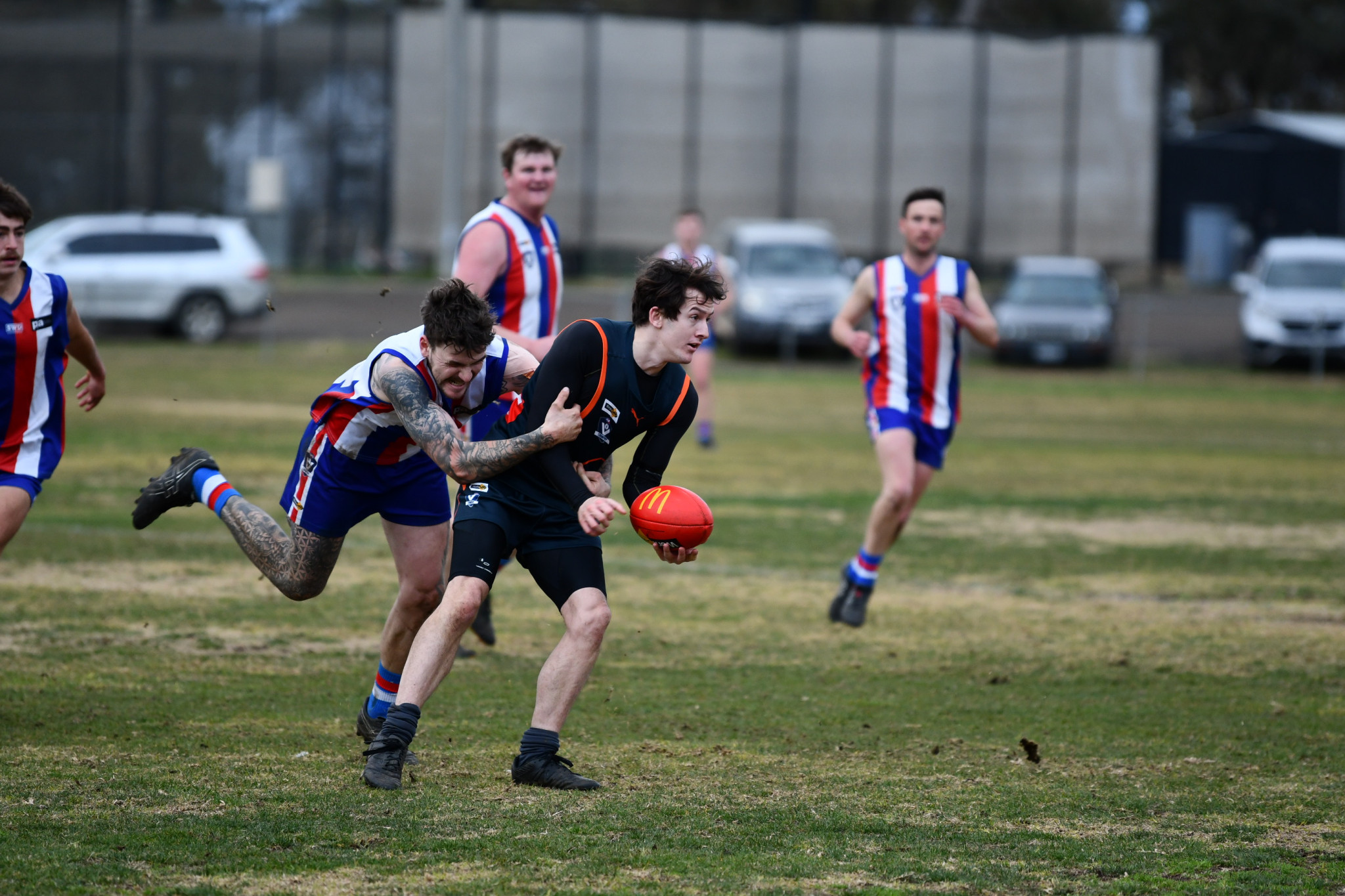 The Giants’ Rhys Wagstaff tries to get a handball off, but is caught by Avoca’s Jordan Thomas.