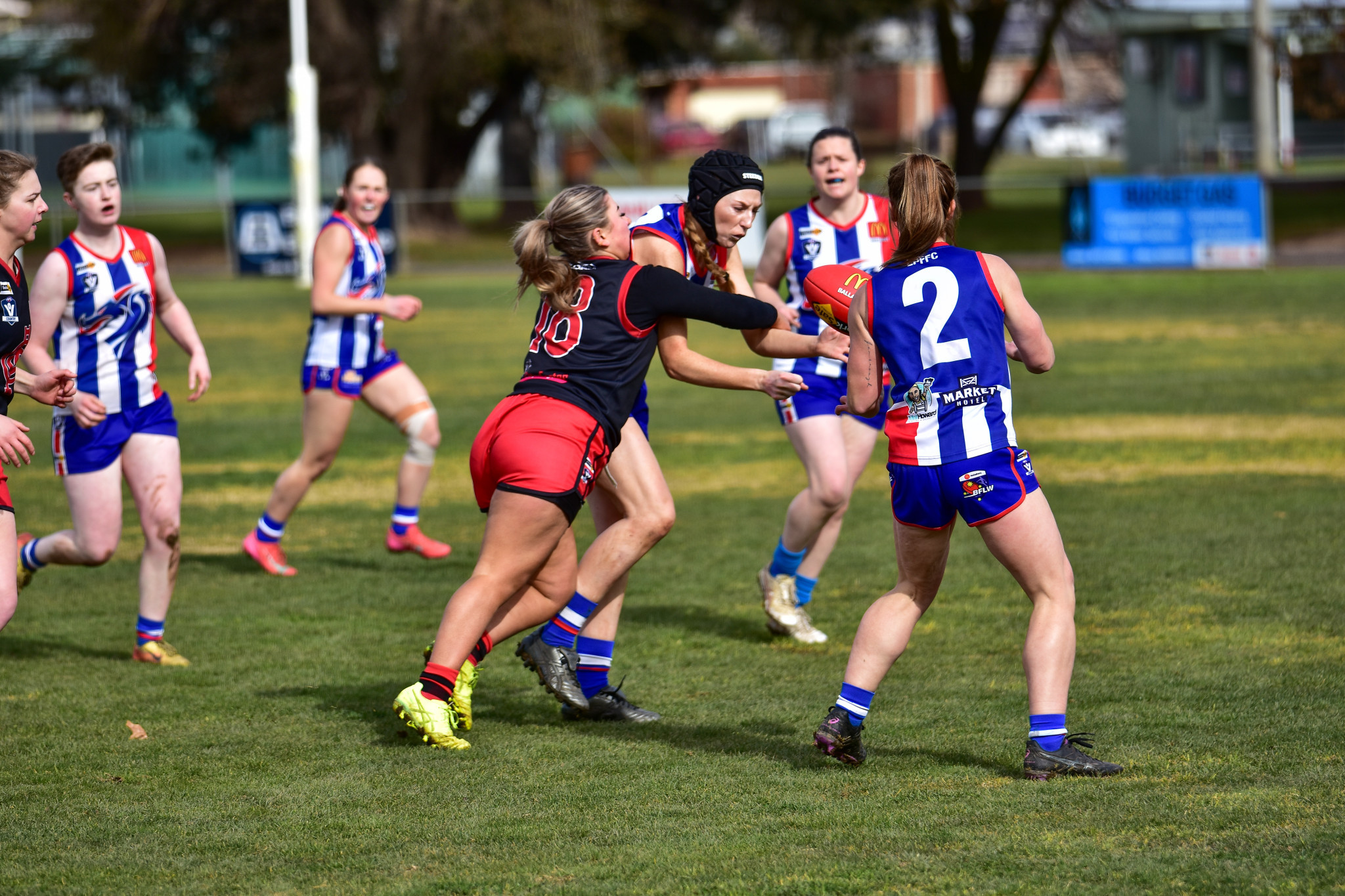 Zeanna Cassells lays a tackle for the Lady Redbacks.