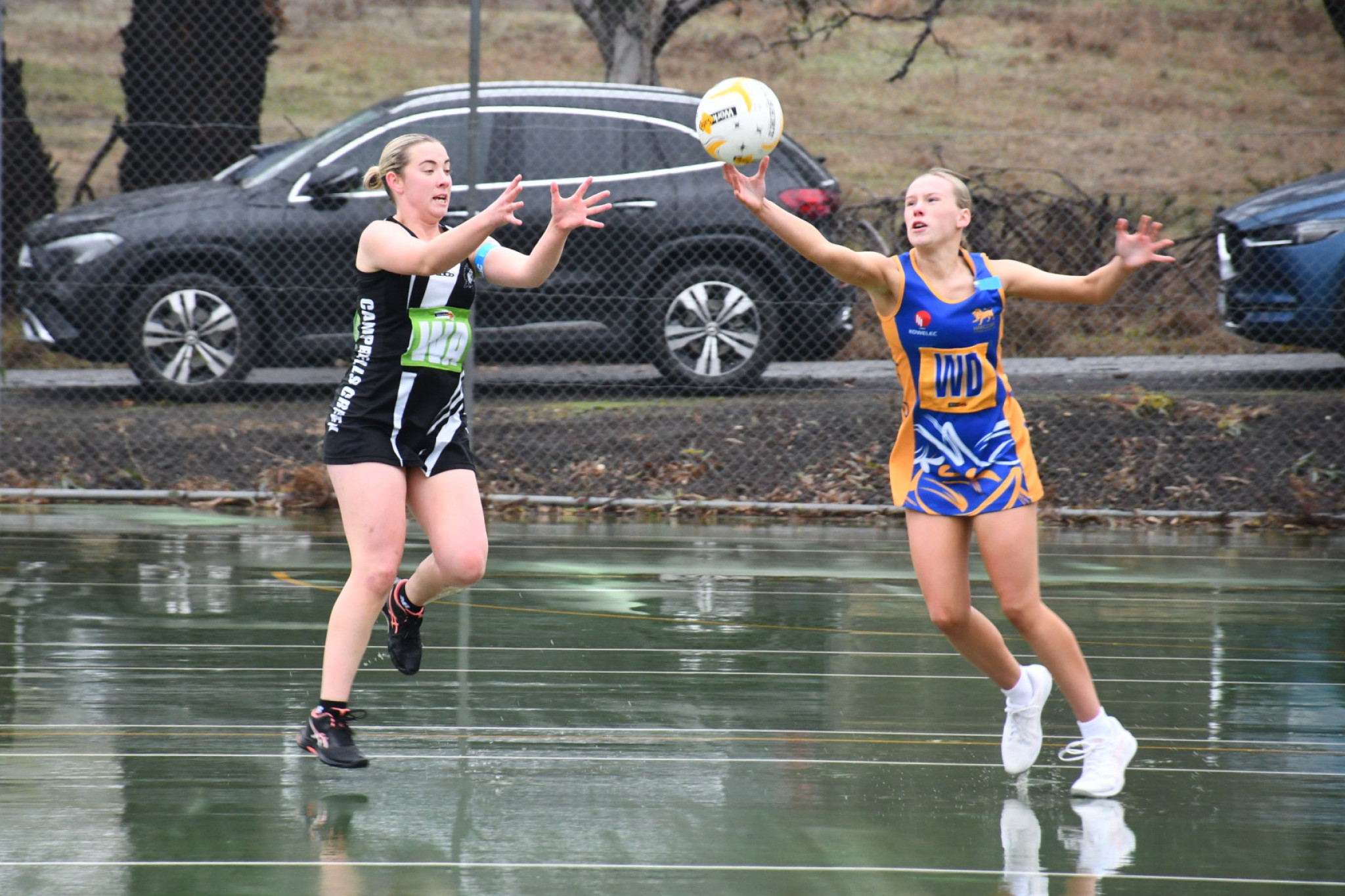 Harcourt’s Milla Berry intercepts a pass intended for Campbells Creek’s Eillish Cumming.