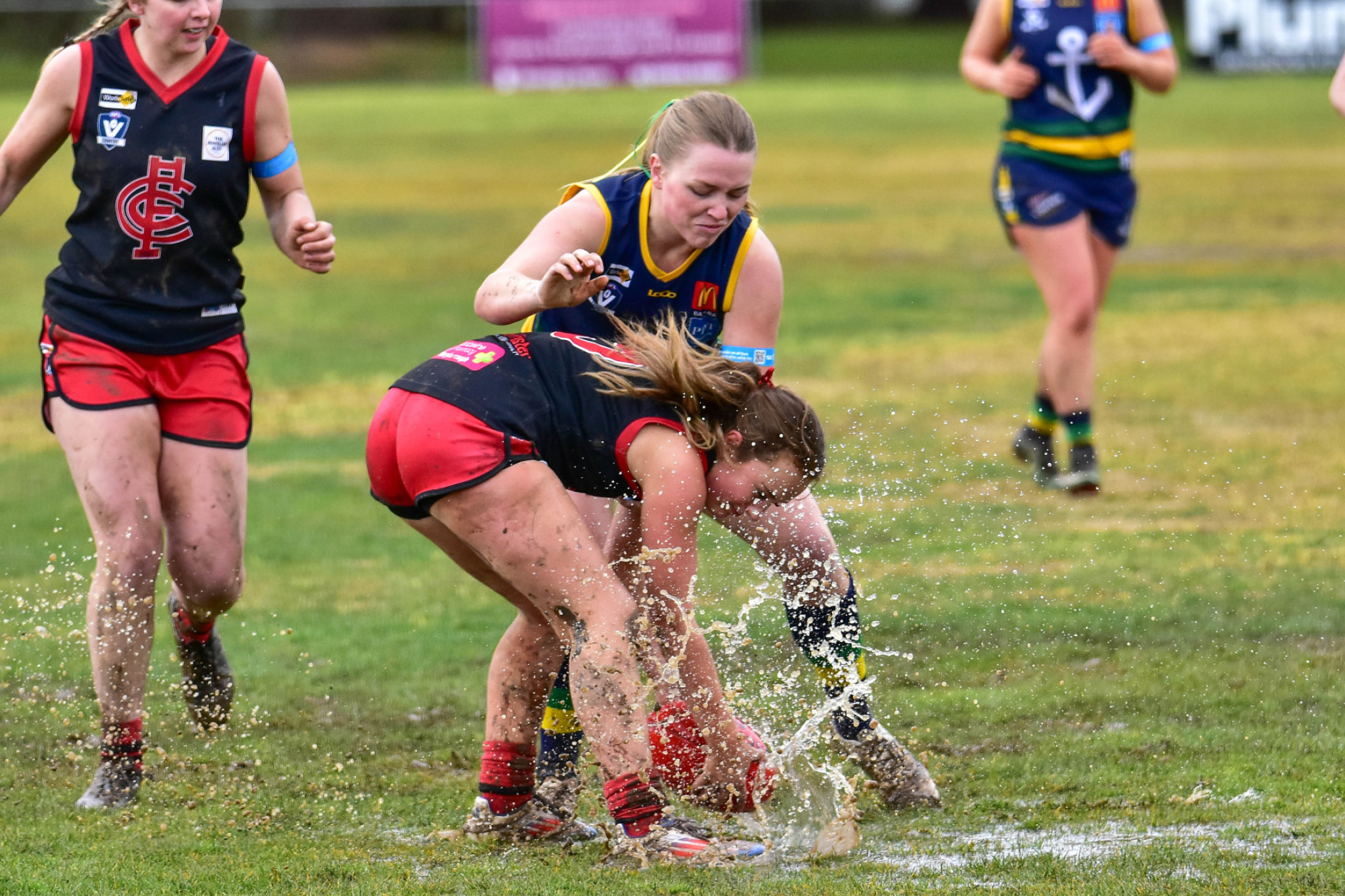 Carisbrook’s Maddison Smith tries to control the ball in the wet.