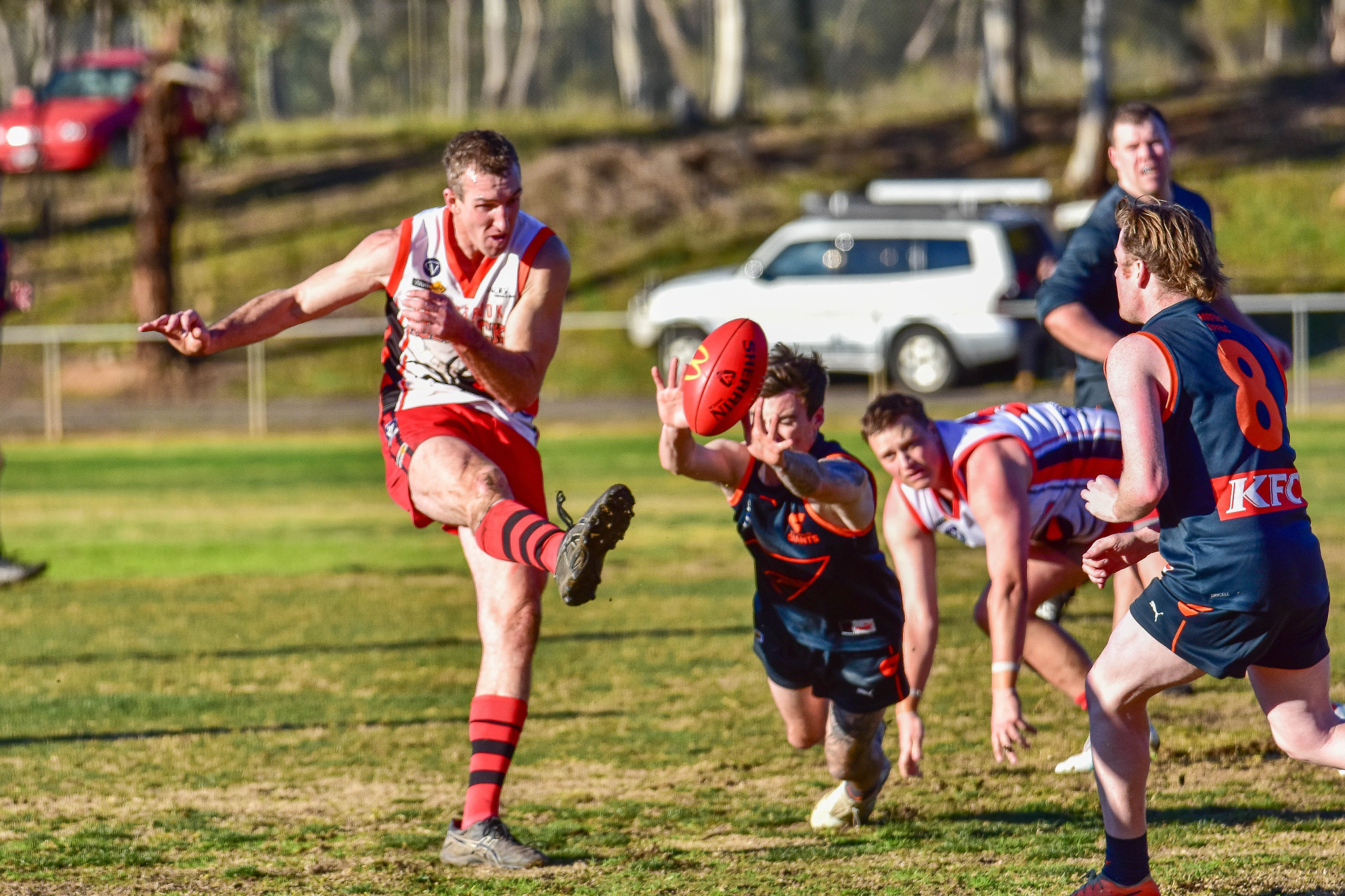 Carisbrook legend Jackson Bowen sends the ball into the forward line.