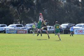 Brady Tillig takes a strong mark for Navarre despite the efforts of Will Brand.