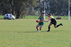 Navarre’s Jack Mentha tries to escape from Lexton’s Jackson Kurzman.
