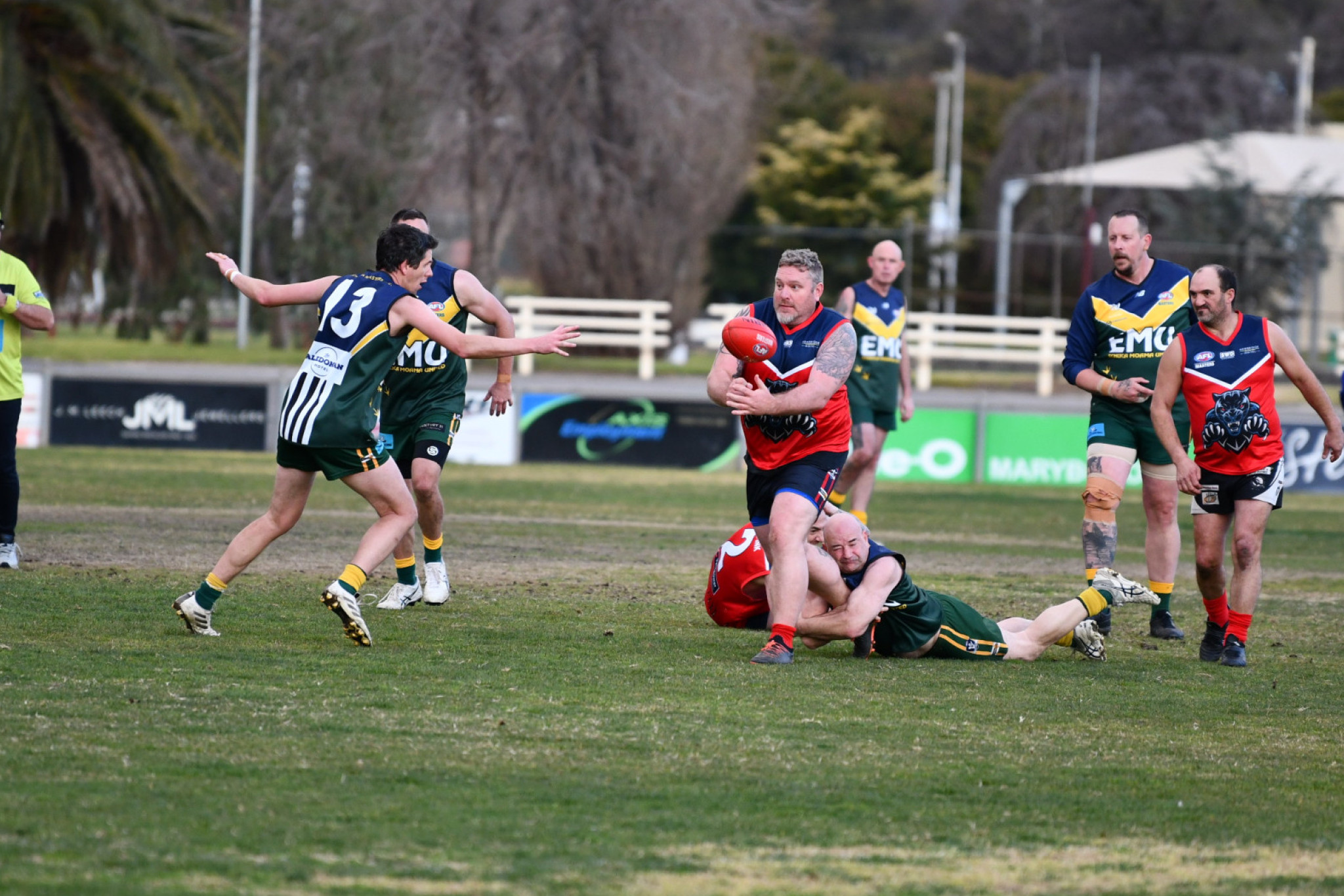 Trevor Chapman gets a handball away for the Maryborough Pumas.