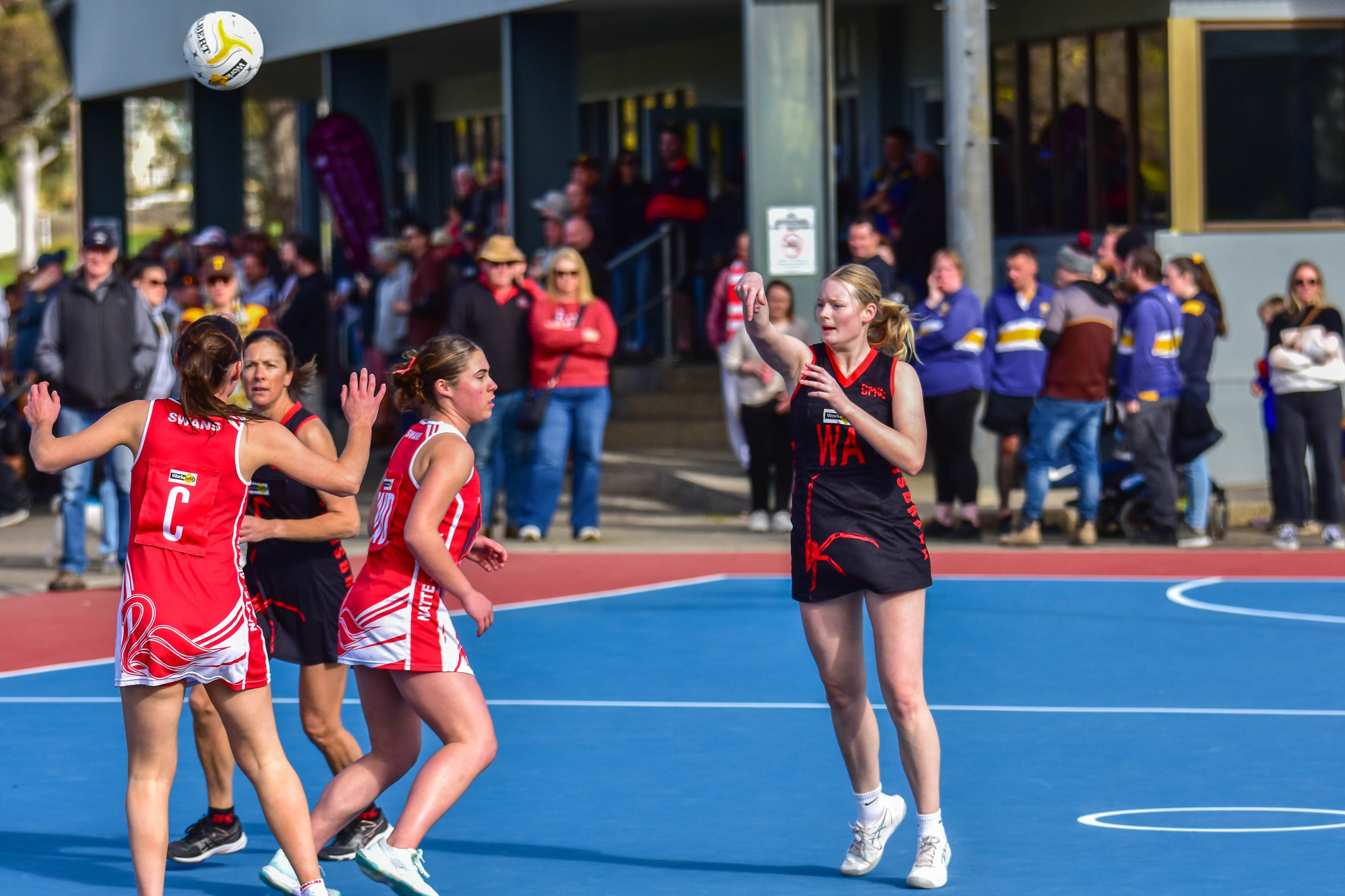 Millie Cassidy sends the ball forward for Carisbrook.