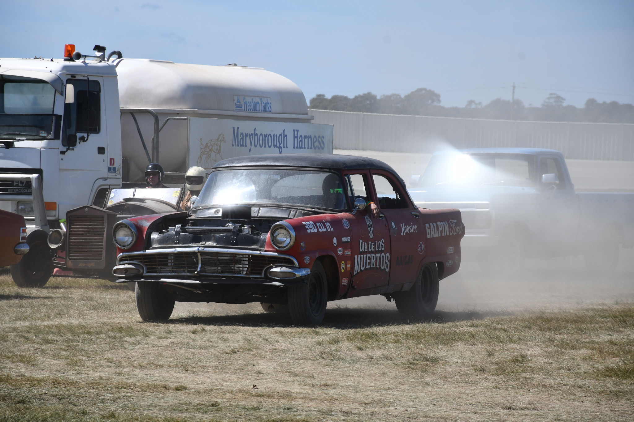 Numerous cars drifted across the dirt at Maryborough Harness Racing Club to drag together.