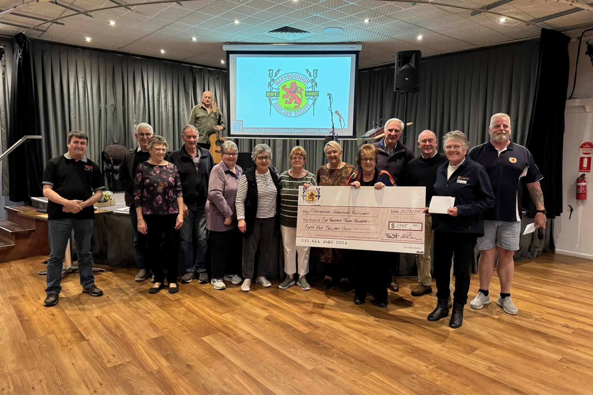 Members of the Maryborough Highland Society, the Maryborough Ambulance Auxiliary and locals gathered for the recent cheque presentation. Photo: Supplied.