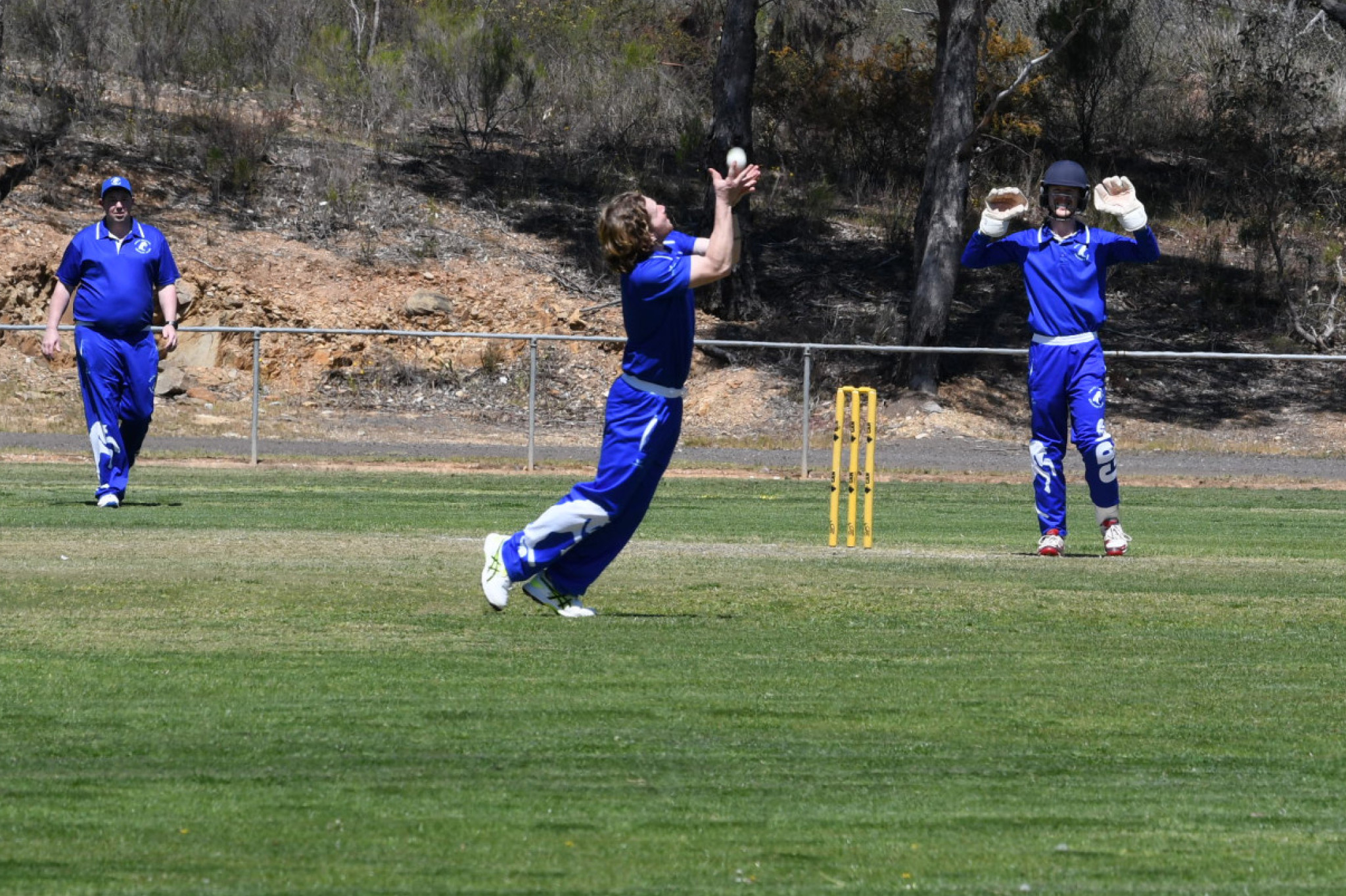 Ben Evans completes a caught and bowled dismissal in his return versus Maryborough.