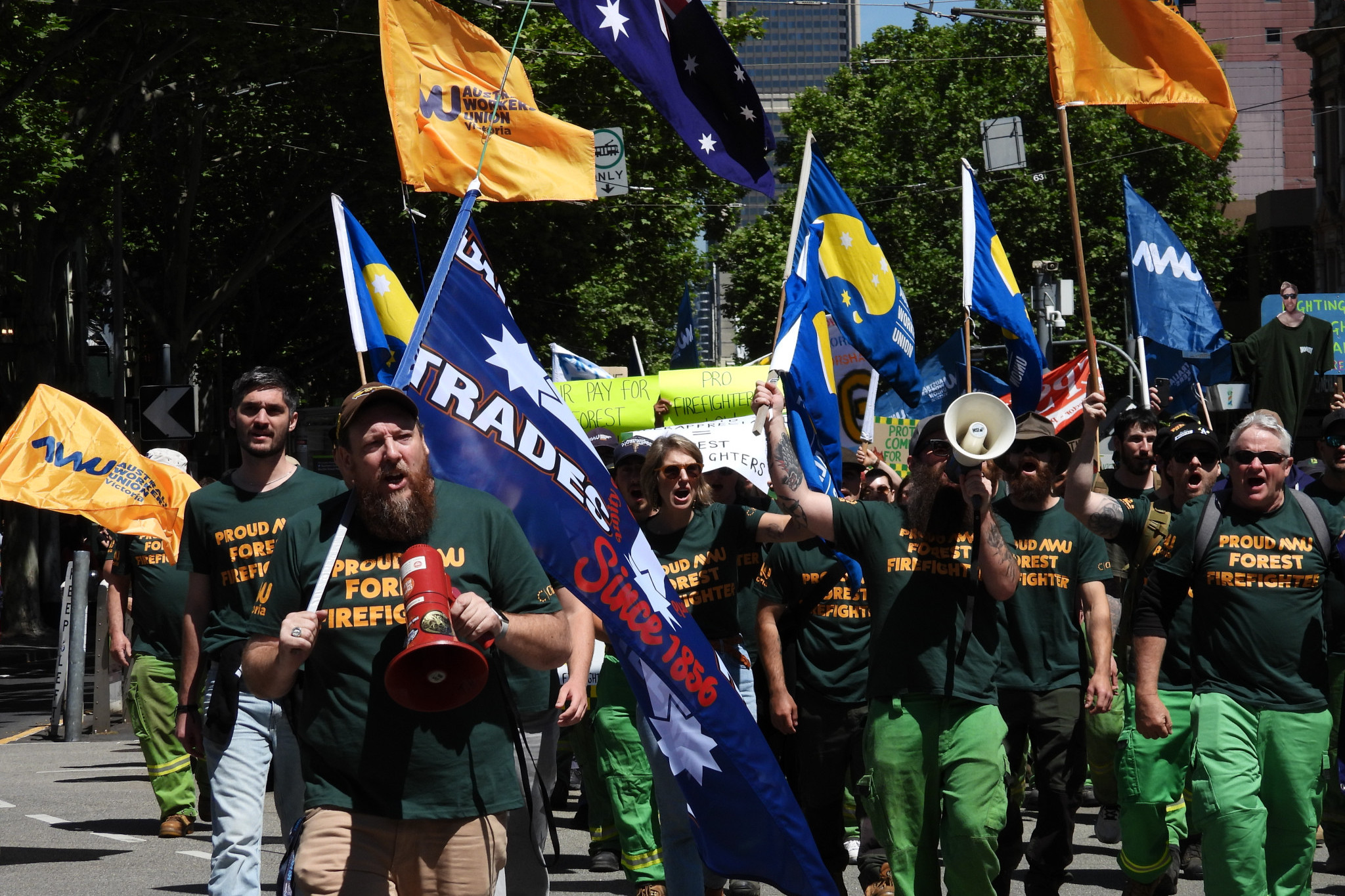 Branch President Ross Kenna with the megaphone, walking down Bourke Street to Parliament. Photo: Supplied.