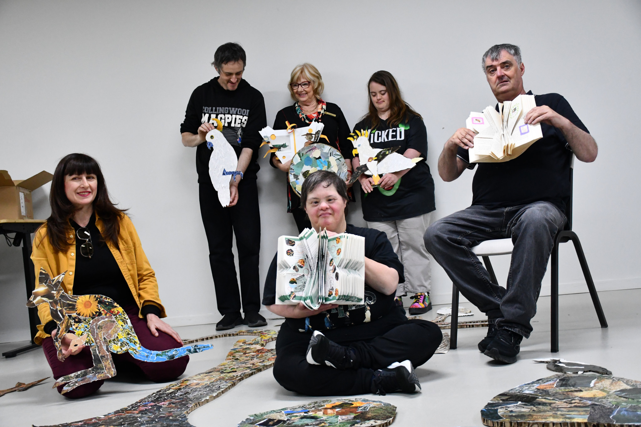 Artist Tiffany Titshall with Blair Lilford, mayor Grace La Vella, Julie Desmond, Jess Clark, and Nick Barber amongst the impressive collage. 071125 11