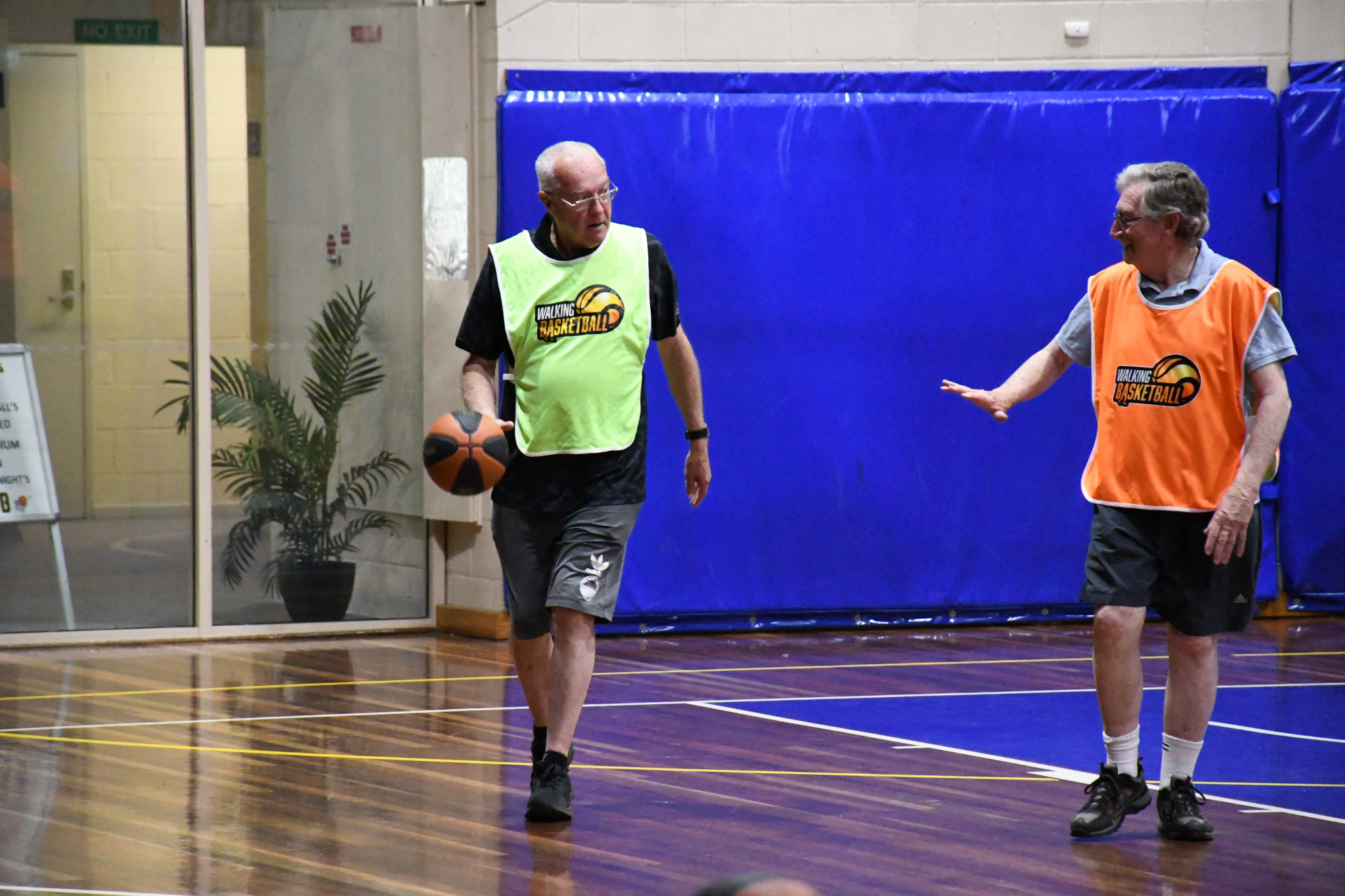 Local Albert Bandy encourages residents to participate in walking basketball.