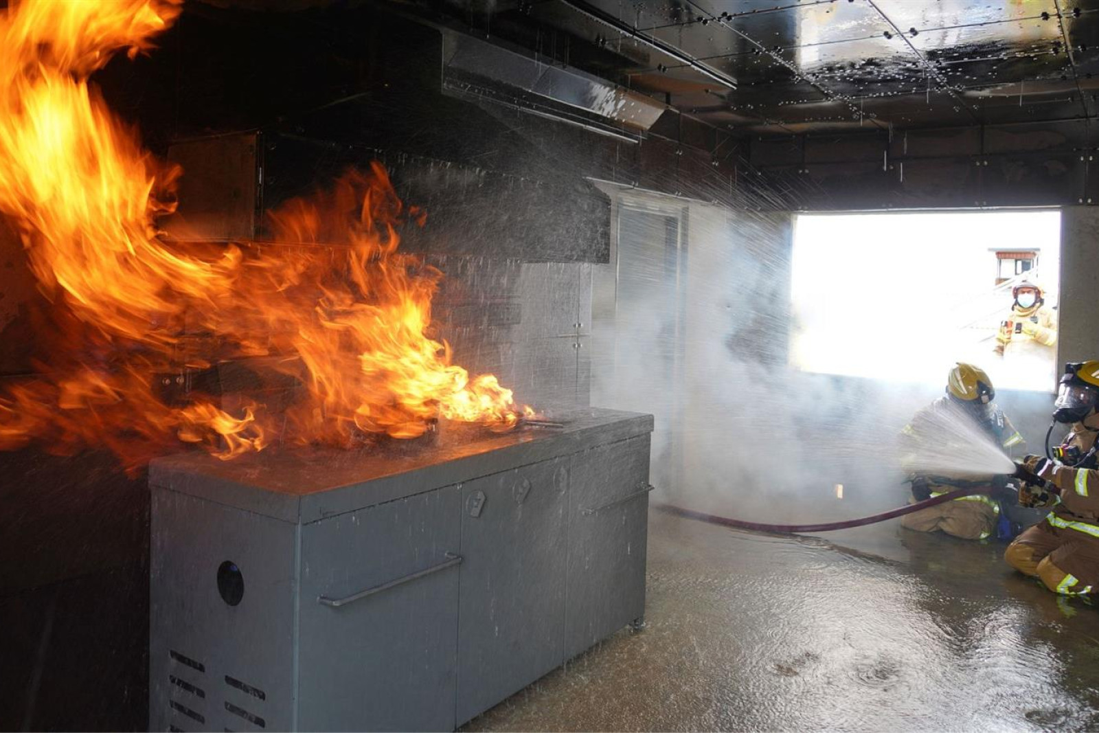 CFA members training for potential kitchen fires. Photo: Supplied.