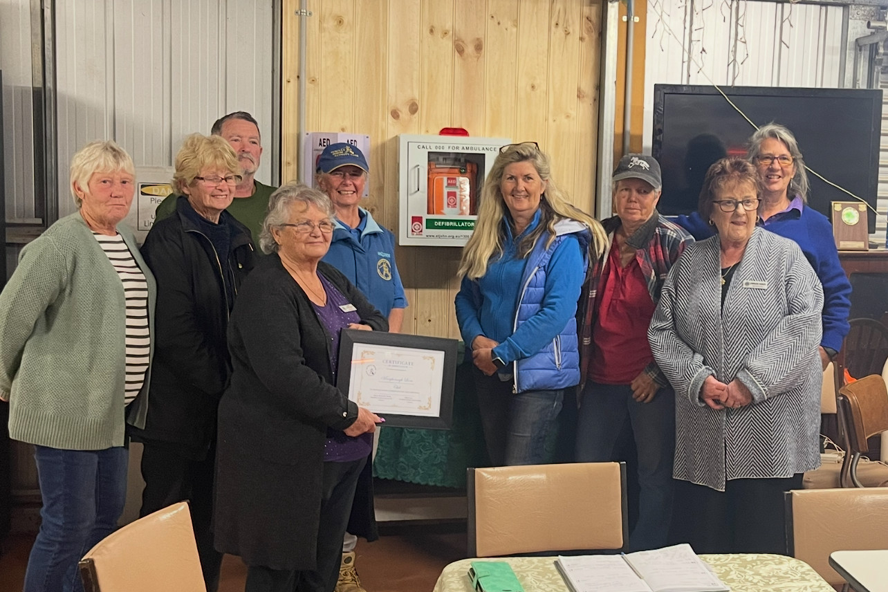 Members of the Dunolly Horse Activity Club and Maryborough Lions Club came together late last month for the installation of a defibrillator at the grounds. Photo: Supplied.