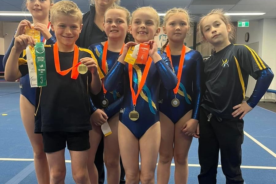 The level three team, with Matilda, coach Maree, Yarraan, Skye, Reagan, Ada and mini-coach Cherry, receiving their medals. Photos: supplied.